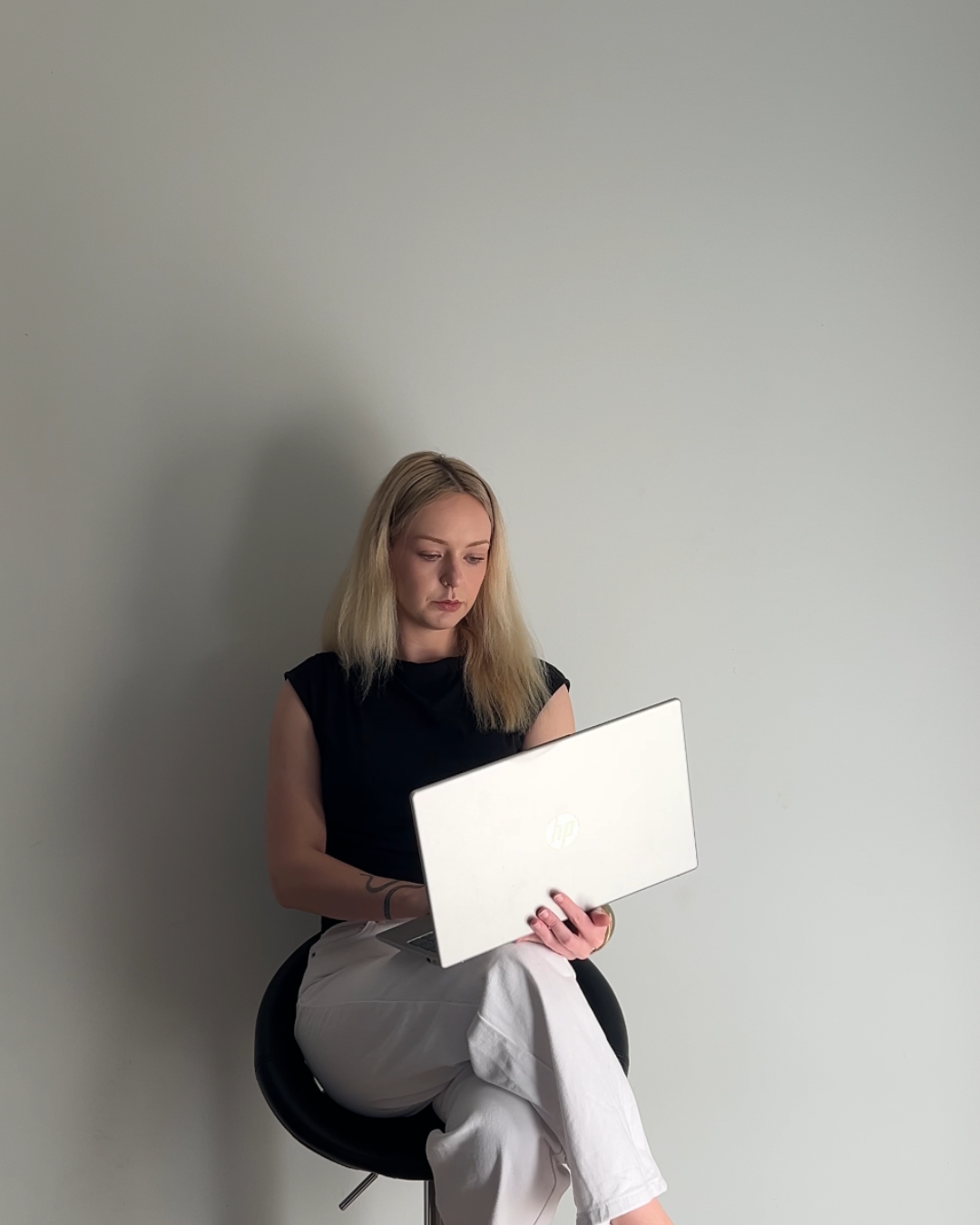 Tegan working on resources at her laptop